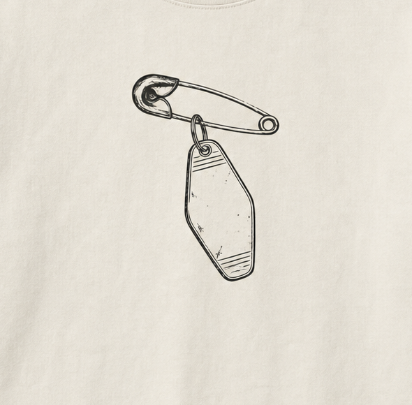 Late Checkout Tee in Cream — artwork detail cropped from the same digital concept mockup. Not a production photograph.